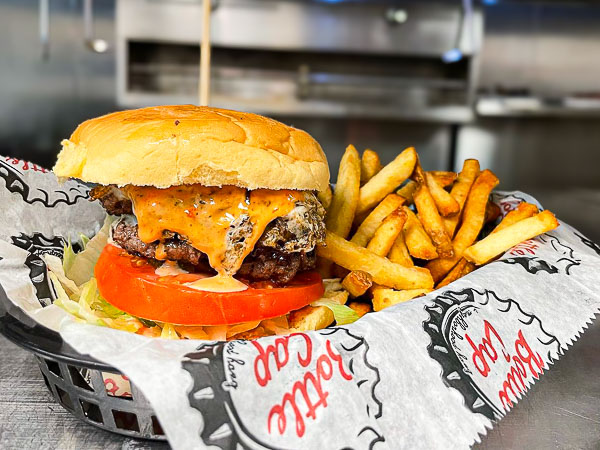 Burger and fries in a Bottle Cap basket